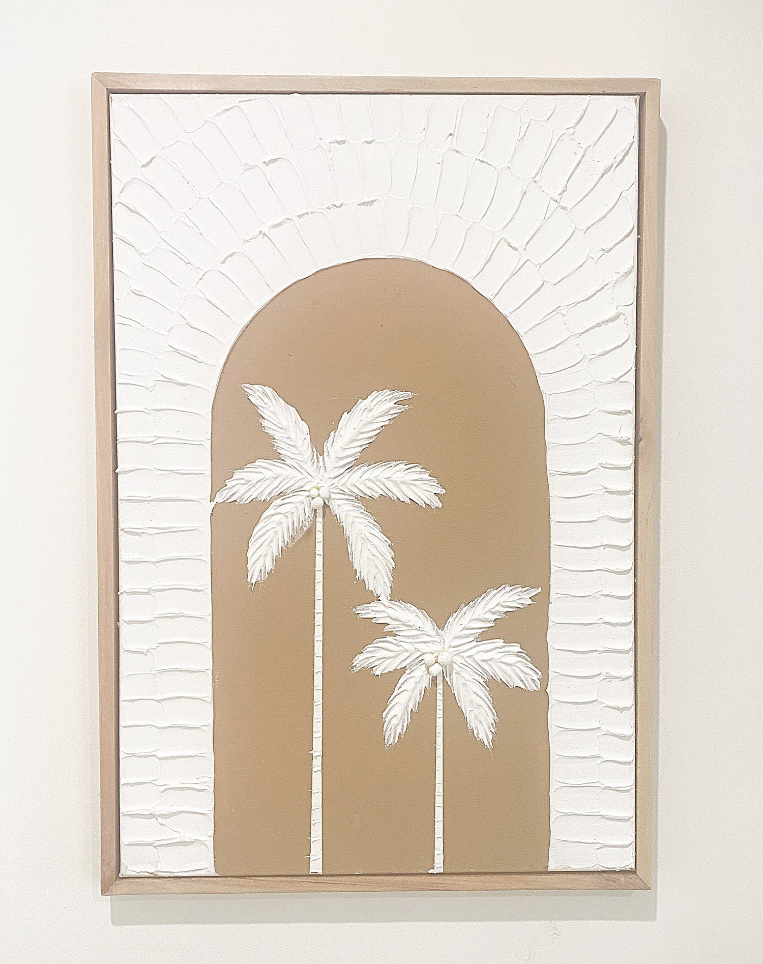 Textured artwork of palm trees in natural tones for serene interiors