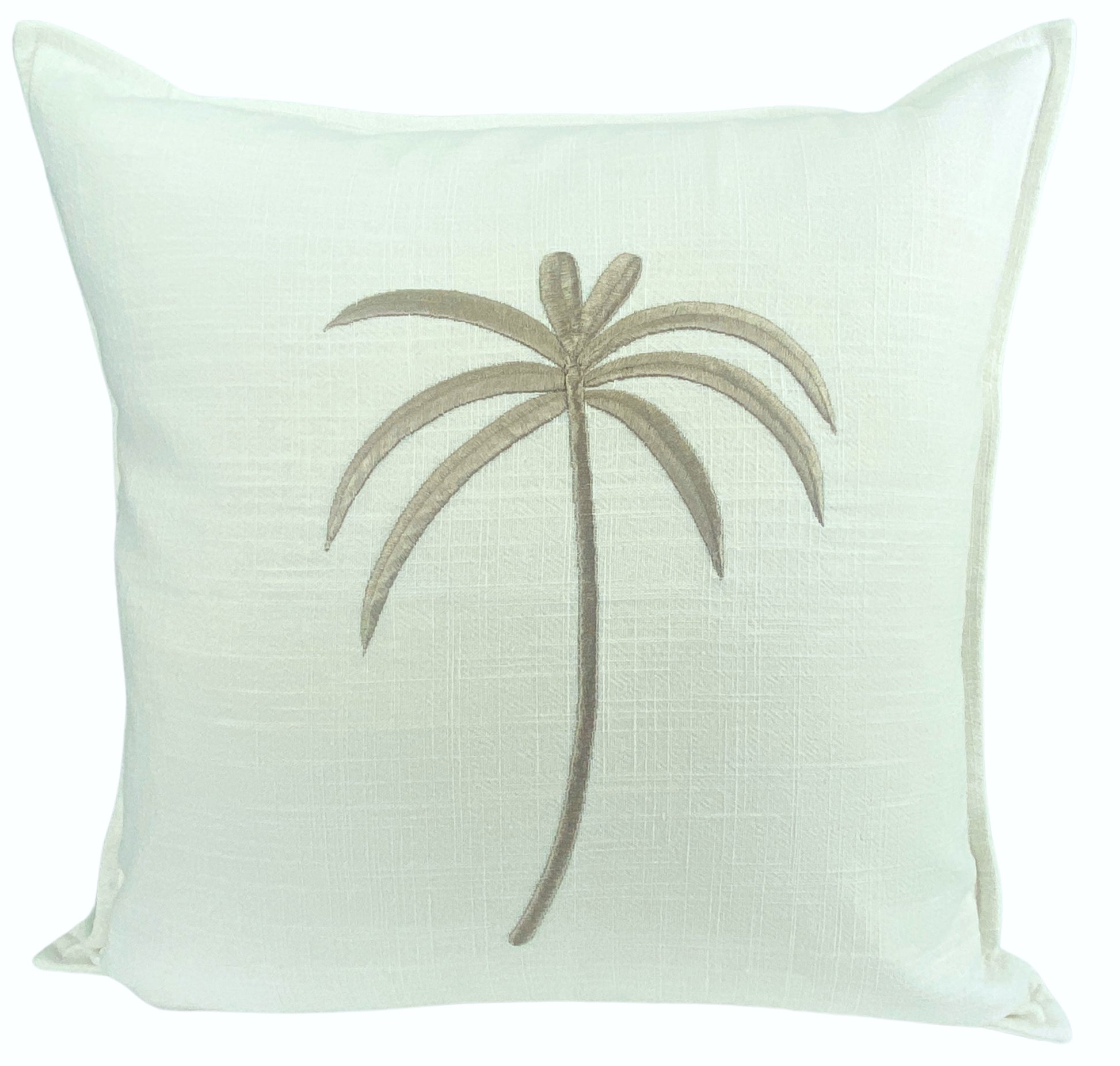 White pillow with a embroidered palm tree design on a white background