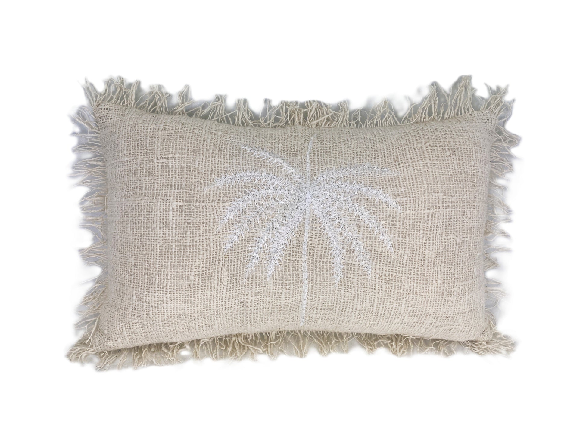 Textured pillow with palm tree design on a white background