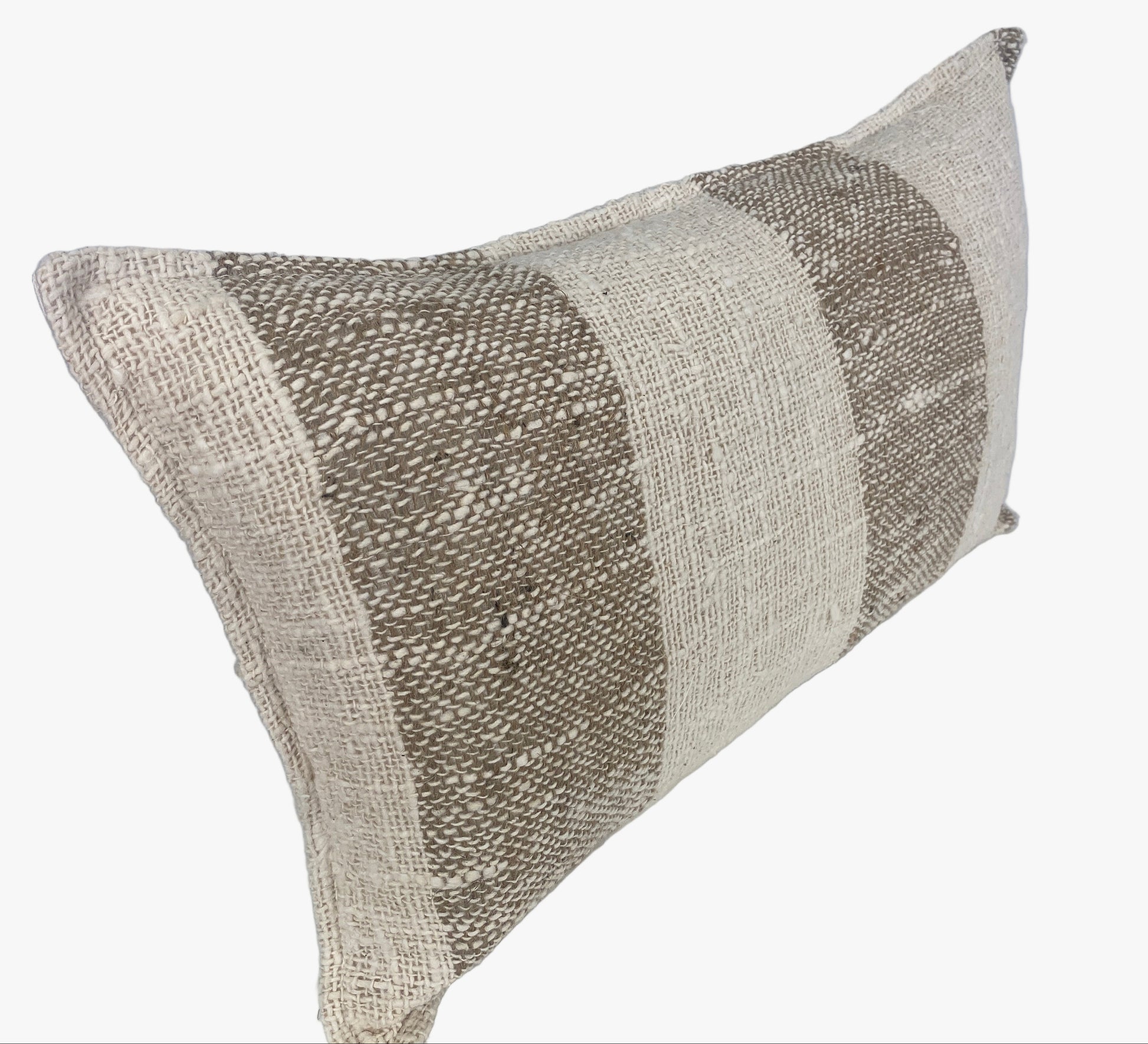 Textured raw cotton cushion cover with a striped pattern on an off white background