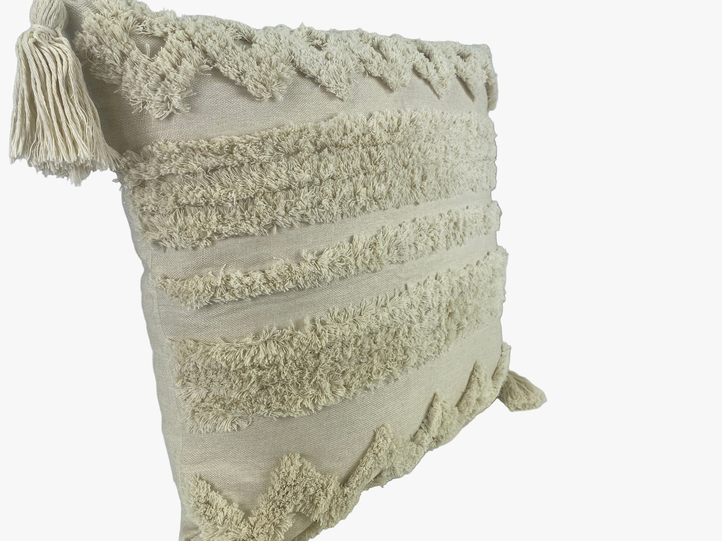 Textured pillow with tassels on a white background
