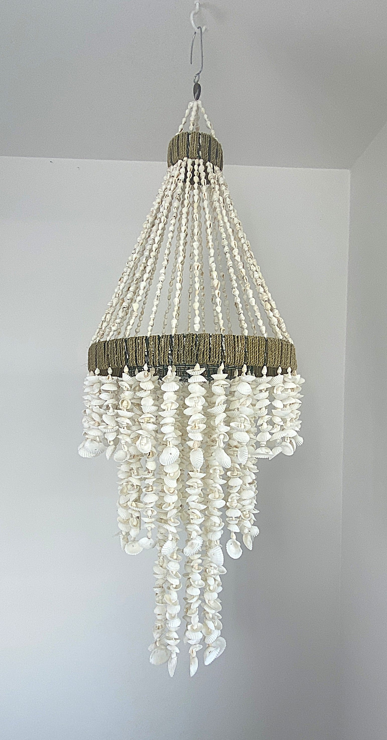 Diamond shaped Shell Chandelier with hand strung strands of textured and smooth shells 
