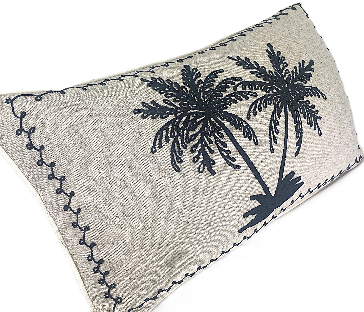 Decorative black embroidered palm cushion on natural background cotton linen blend 50x30cm side view