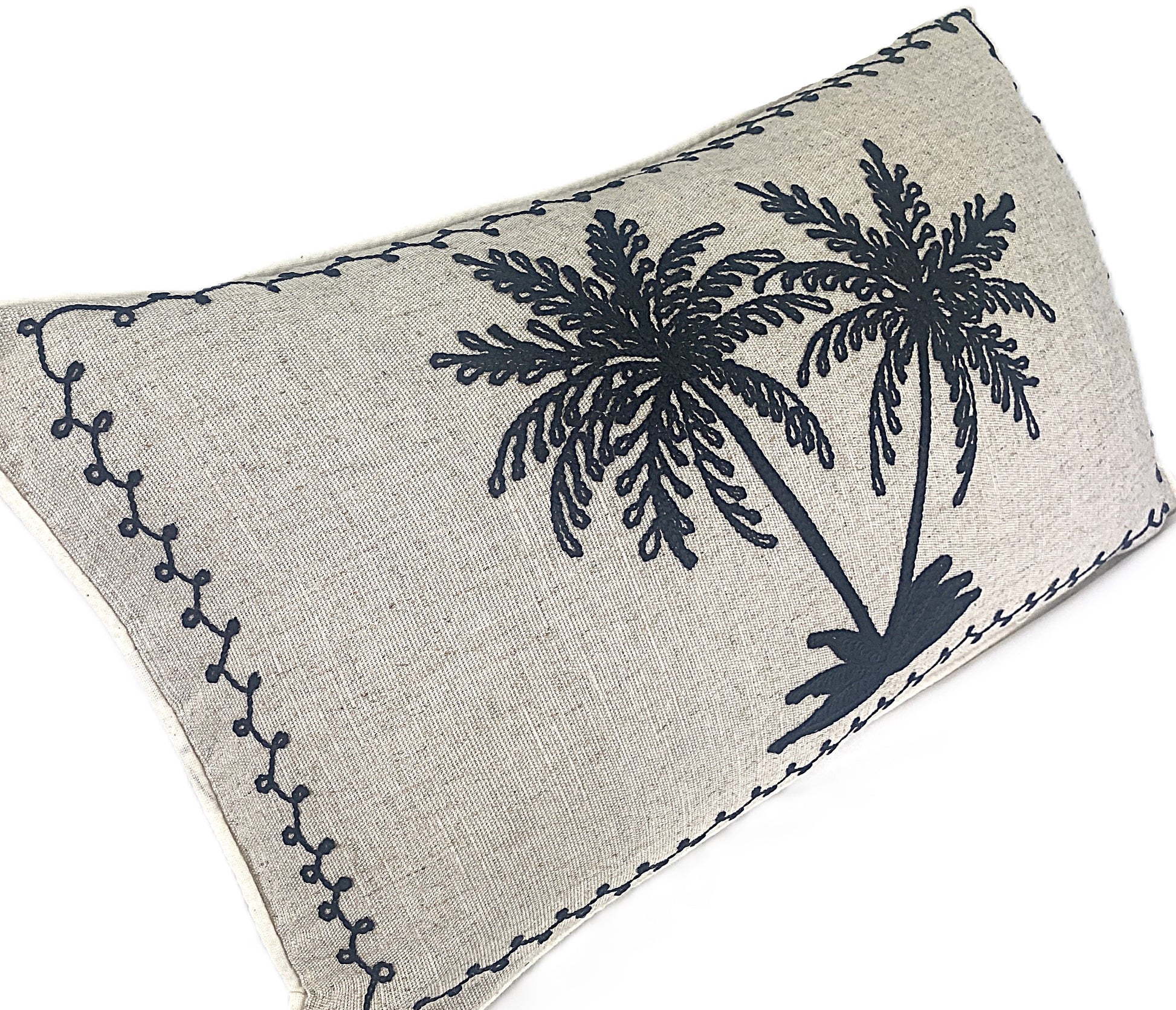 Decorative black embroidered palm cushion on natural background cotton linen blend 50x30cm side view