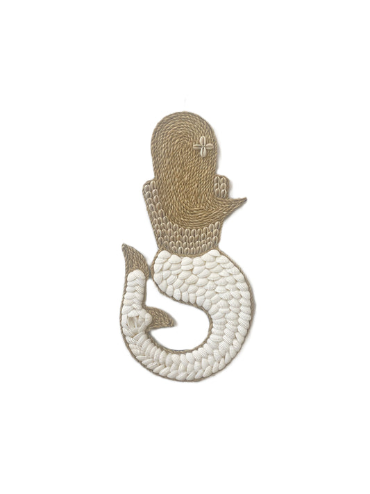Handmade mermaid shell wall art with cowrie shell top and white tail on a white background