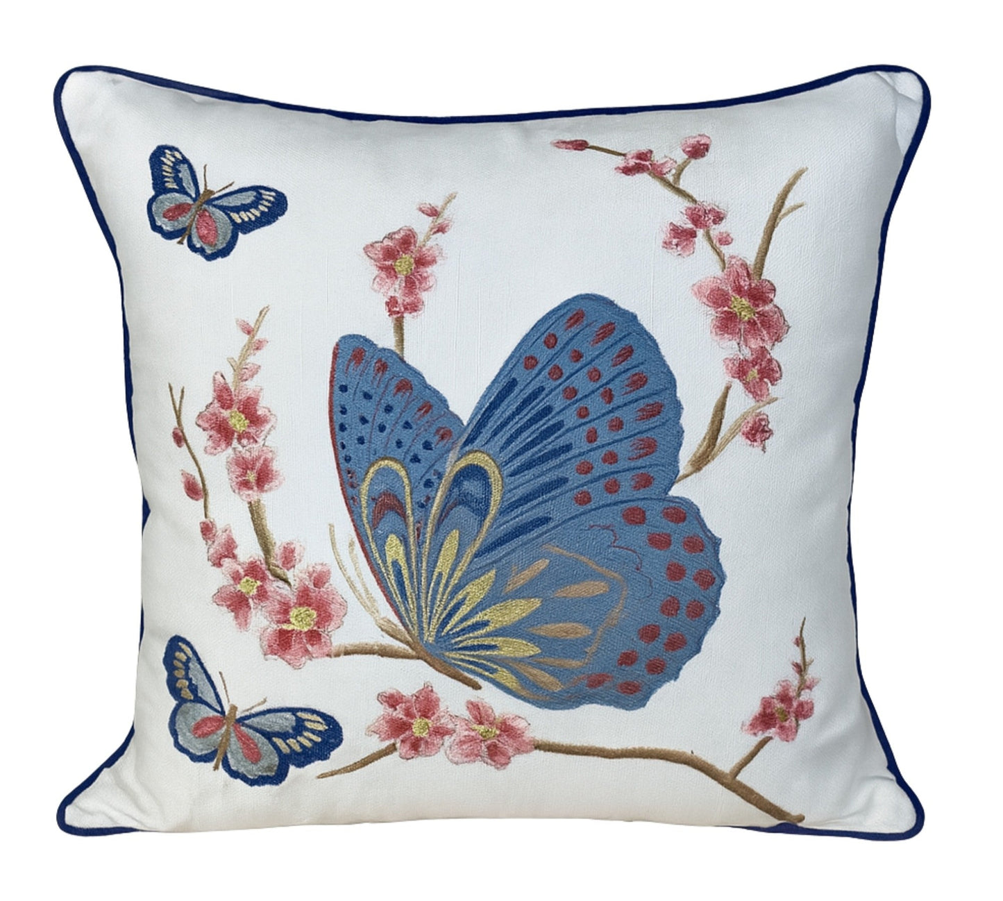 Decorative pillow with embroidered butterflies and flowers on a white background